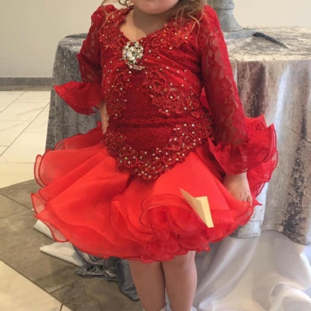 Red cupcake pageant dress, size 6/8. Red and clear rhinestones cover the bodice